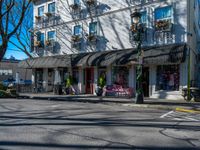 a building on a city street with some benches in it and a bench outside the building