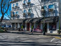 a building on a city street with some benches in it and a bench outside the building