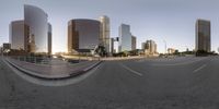 a fish eye view of a city street in a spherical panorama 360 lens way looking down the road