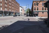 street view of downtown building with busy street intersection in background on sunny day with clear sky