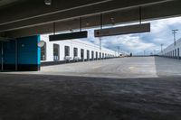 an empty parking garage with a train sitting in it's compartment and waiting people to board