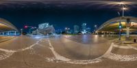 a fish eye lens at night of the city streets and skylines along the river