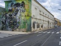 this is the picture of a mural in the area near an abandoned factory building that is being converted into a commercial street