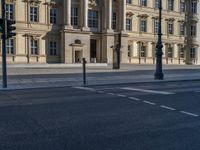 two lanes that appear to be in the middle of the road, and are straight lines to the left