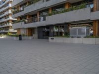 a view of a city street and a residential building from the outside with no roof