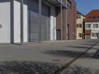 a street view with a fire hydrant in front of it and a few buildings in the distance