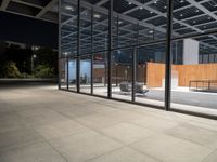 the glass doors on this building provide privacy and sunlight to the space below, while sitting in a chair