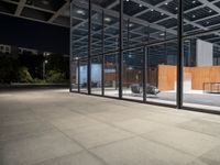 the glass doors on this building provide privacy and sunlight to the space below, while sitting in a chair