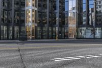 a city street with buildings that are on both sides and one side is empty, as the other one is empty