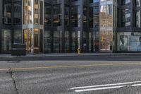 a city street with buildings that are on both sides and one side is empty, as the other one is empty