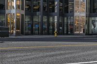 a city street with buildings that are on both sides and one side is empty, as the other one is empty