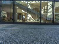 Urban Design: Glass Walls on Cobblestone Streets