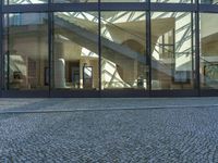 Urban Design: Glass Walls on Cobblestone Streets