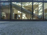 Urban Design: Glass Walls on Cobblestone Streets