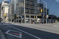 empty city street in an urban area with a lot of tall buildings in the background