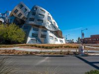 the curved building looks like a giant cube in the city of los angeles, california