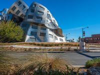 the curved building looks like a giant cube in the city of los angeles, california