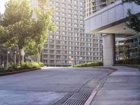 a woman in red dress on the street next to building with windows on side of street