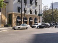 a busy street is shown near the hotel where the police officers are working to protect it