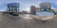 a fisheye fisheye lens with cars on the street and buildings in the background