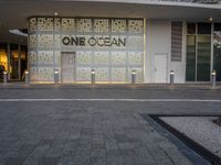 a shopfront with one ocean written on the side of the building at the entrance