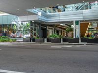 this is an image of a street corner with a stop light and two planters