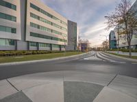 an image of the corner of the street in front of a big building taken with a fisheye lens