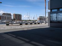 the view of some building and cars and buildings outside of it's entrance doors