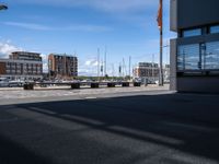 the view of some building and cars and buildings outside of it's entrance doors