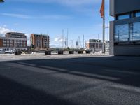 the view of some building and cars and buildings outside of it's entrance doors