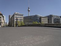 a cityscape with buildings and a sky tower in the background and chalk writing