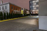 the yellow curb and red brick building are both visible in the night sky as well