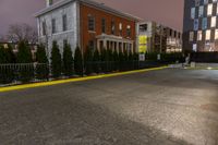 the yellow curb and red brick building are both visible in the night sky as well