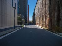 a street is paved with two lane streets on both sides, while another street is surrounded by several buildings