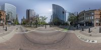 a wide angle of some buildings on the street corner, a very low angle to the intersection