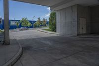 the building has several cars parked in front of it next to the street in the parking lot