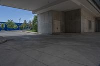 the building has several cars parked in front of it next to the street in the parking lot