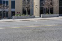 the yellow line shows where the stop signs are on the street and the building is empty