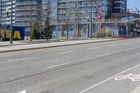 this is the view from the corner of an empty street in front of a large building