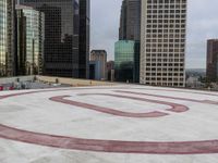 several empty skate boards in the middle of an area with many tall buildings and signs