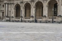 a man is walking on the street with a backpack and some poles and a bench