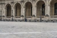 a man is walking on the street with a backpack and some poles and a bench