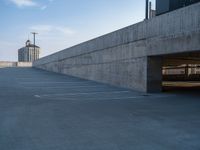 several large empty parking spaces in the city with buildings nearby in front of them -