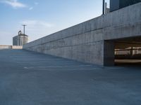 several large empty parking spaces in the city with buildings nearby in front of them -