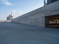 several large empty parking spaces in the city with buildings nearby in front of them -