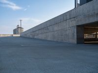 several large empty parking spaces in the city with buildings nearby in front of them -