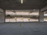 an empty parking garage with no one waiting for any person to walk by the windows