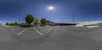 the view of a parking lot from a fisheye lenser viewfinder point of the parking lot, where two cars are in a circular circle