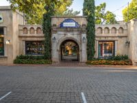 an image of a building at the disneyland resort in california california, usa on an angle with cars passing through it