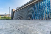 a very large building with a lot of glass doors on it's sides and sides